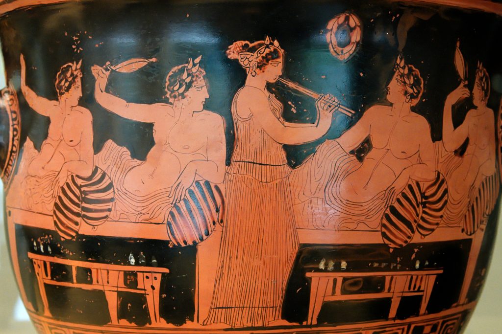 Scena da un simposio dell’antica Grecia (Wikimedia)